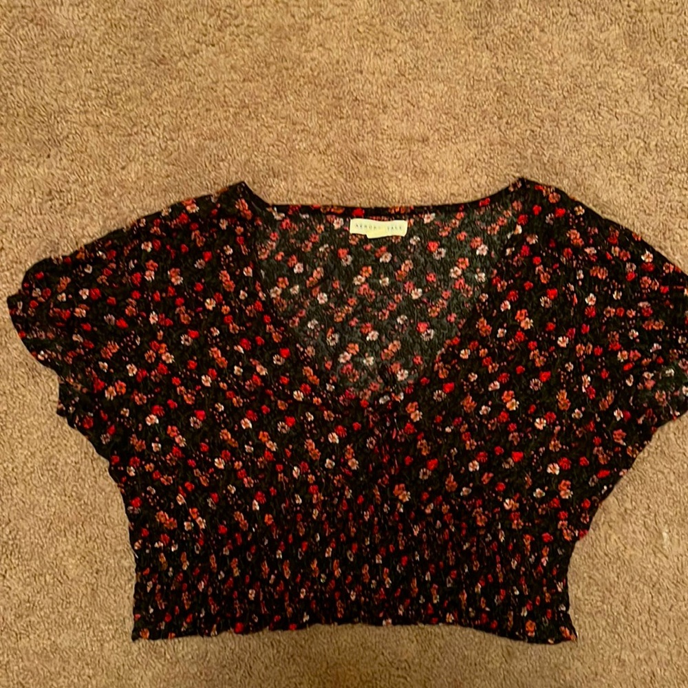 Crop top with red and pink flowers and tie in the front.